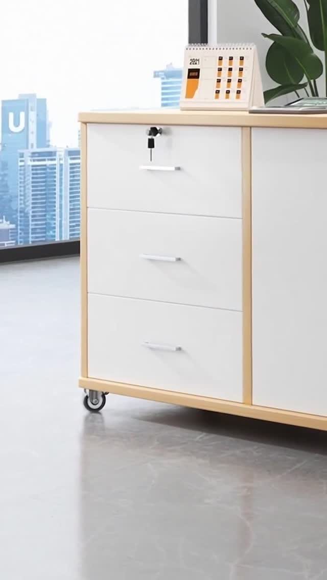 Furniture on Wheels: 19 Ideas for Rolling Pieces That Move 4 White office cabinet with light wood trim and a small black swivel caster wheel.