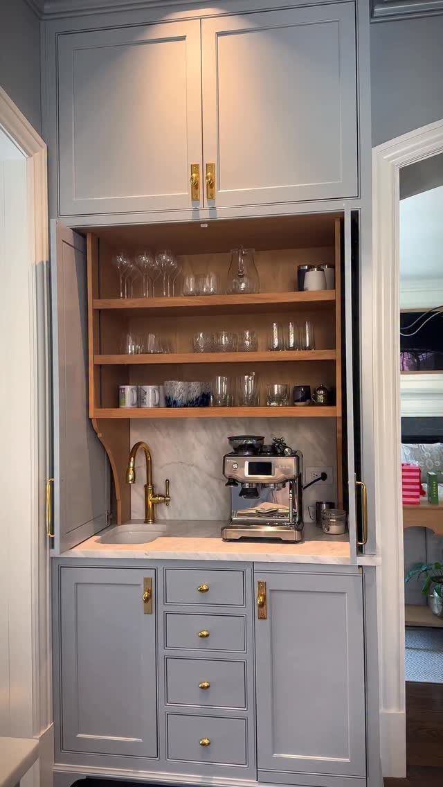 Hidden Coffee Bar Cabinet: 17 Ideas for Every Style 4 Grey built-in coffee bar armoire with wooden shelves, espresso machine, and gold faucet.