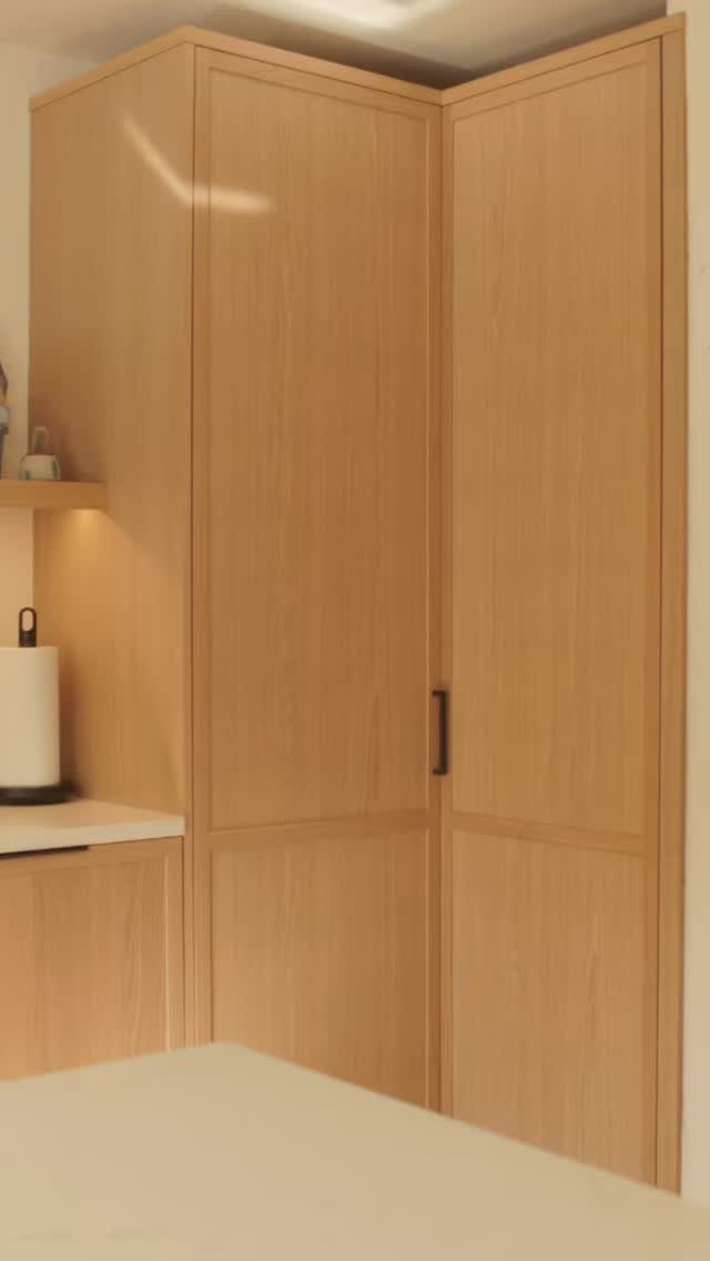 Kitchen Wood Pantry: 40 Ideas with Glass, Drawers, and Doors 15 Light wood corner pantry cabinet with tall doors and a small side counter.