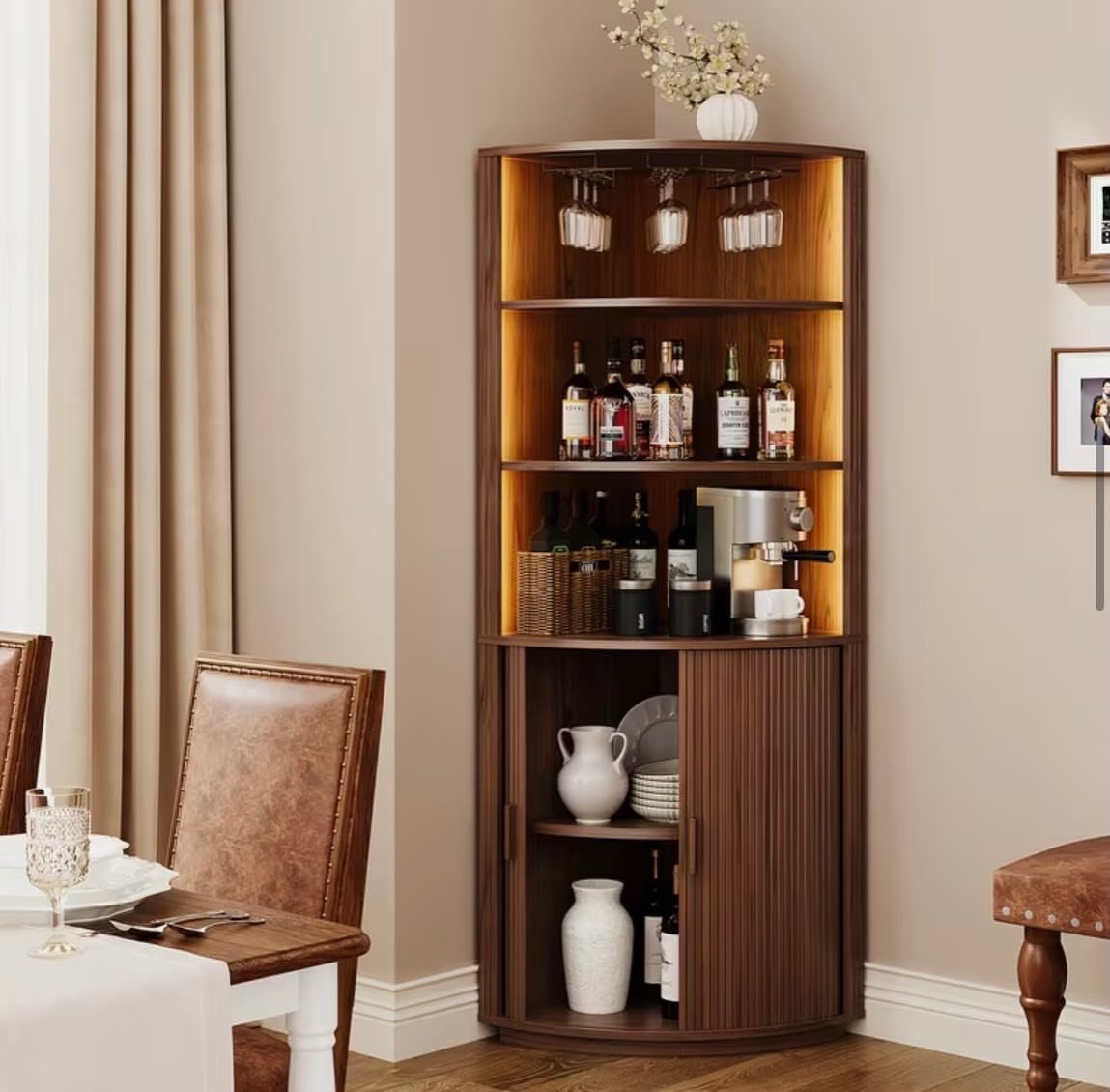 Dining Room Armoire: 16 Ideas for Storage and Style 15 Curved brown wooden corner cabinet with liquor bottles and integrated warm lighting.