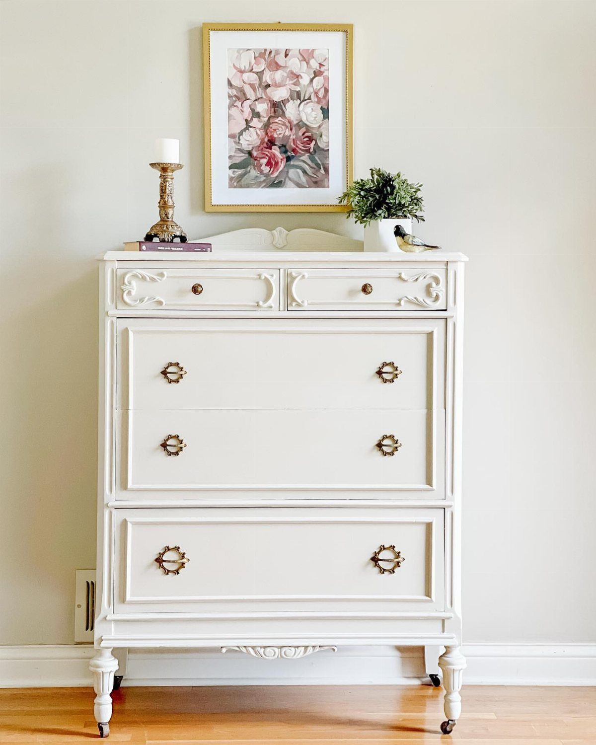 Furniture on Wheels: 19 Ideas for Rolling Pieces That Move 5 White vintage dresser with gold handles and small wheels on the legs.
