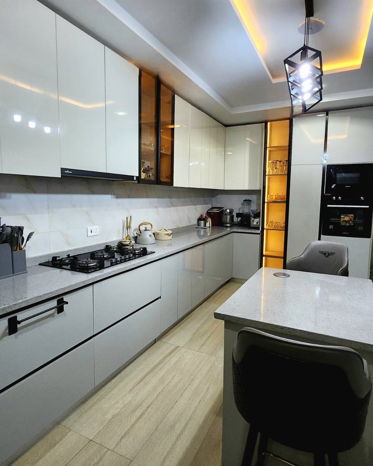 Dual-tone kitchen cabinets with white upper units and light grey lower units.