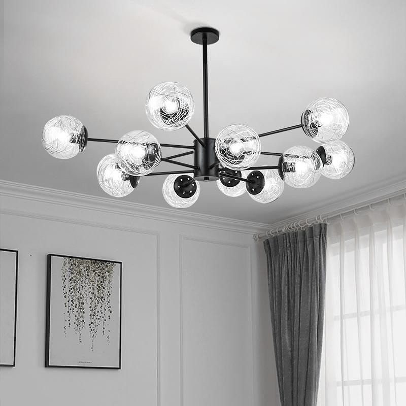 Modern black chandelier with multiple crackled glass globe lights on a white ceiling.
