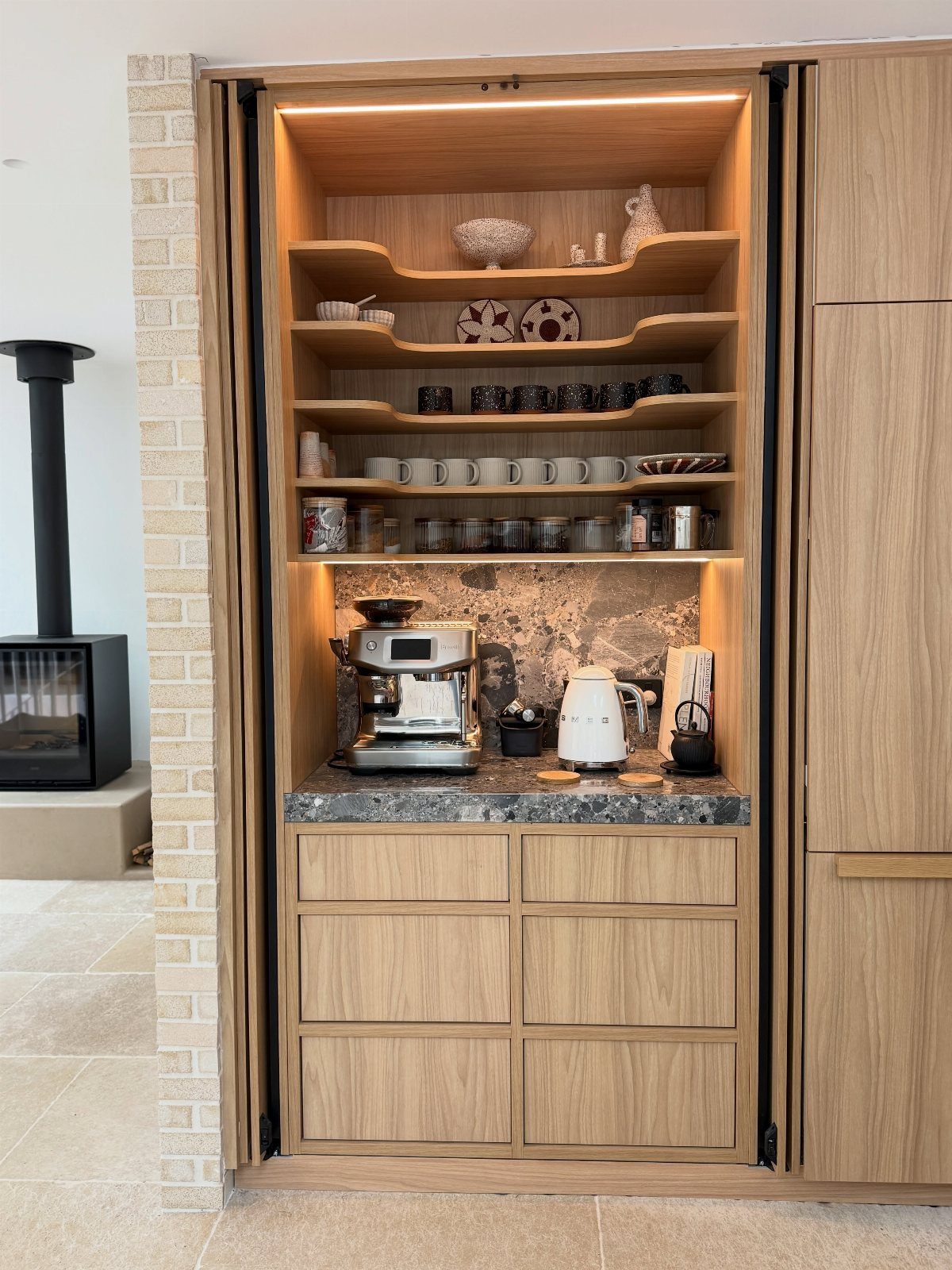 Hidden Coffee Bar Cabinet: 17 Ideas for Every Style 16 Built-in light wood coffee bar cabinet with espresso machine and shelving