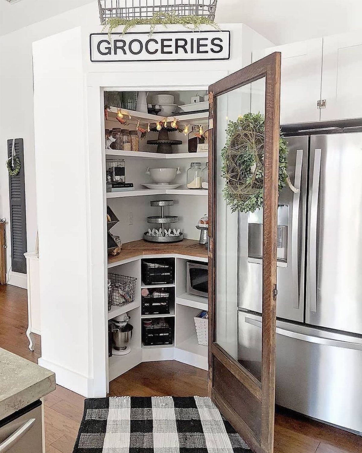 Kitchen Wood Pantry: 40 Ideas with Glass, Drawers, and Doors 33 Pantry door with a black and white Groceries sign mounted above the frame