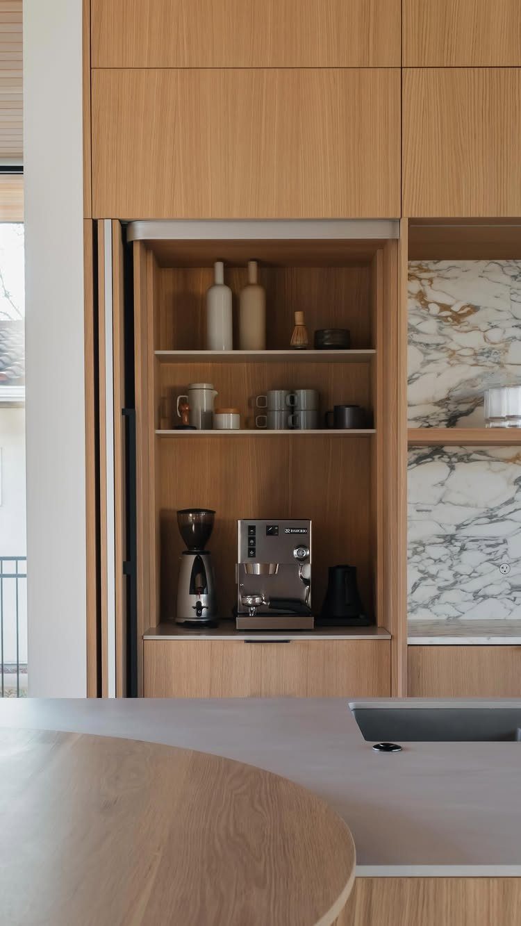 Hidden Coffee Bar Cabinet: 17 Ideas for Every Style 2 Light wood kitchen cabinet with a pocket door revealing a built-in coffee station.