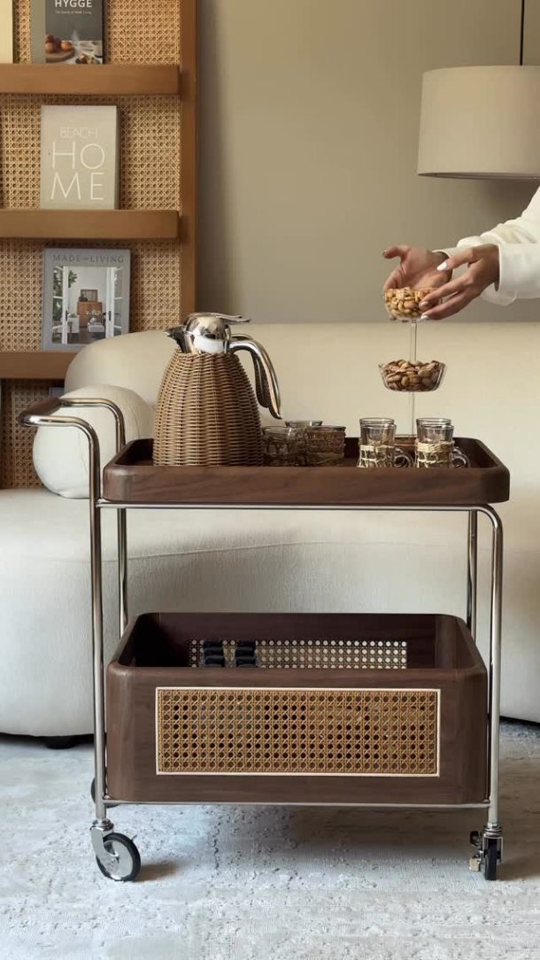 Furniture on Wheels: 19 Ideas for Rolling Pieces That Move 15 Two-tier wooden bar cart with chrome frames and wheels in a living room.