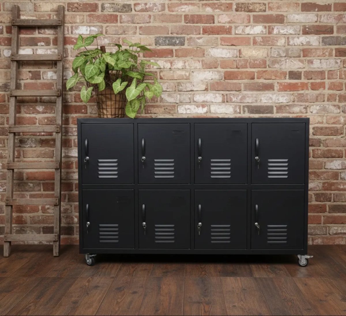 Furniture on Wheels: 19 Ideas for Rolling Pieces That Move 14 Black metal locker cabinet on caster wheels against a red brick wall.