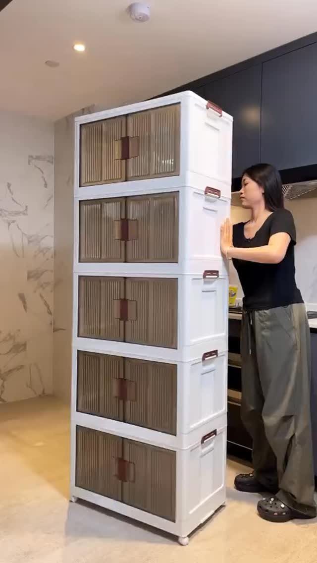 Furniture on Wheels: 19 Ideas for Rolling Pieces That Move 10 White plastic storage cabinet with brown doors on wheels in a modern kitchen