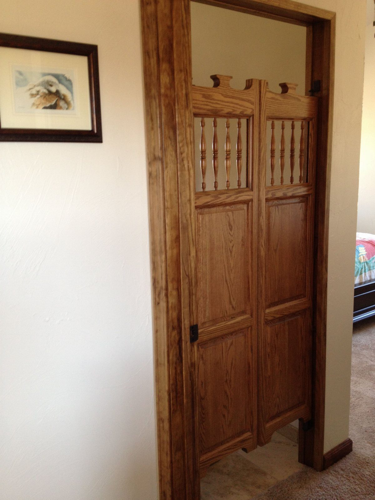 Kitchen Wood Pantry: 40 Ideas with Glass, Drawers, and Doors 30 Wooden saloon-style swinging doors with spindles installed in a matching wood frame.